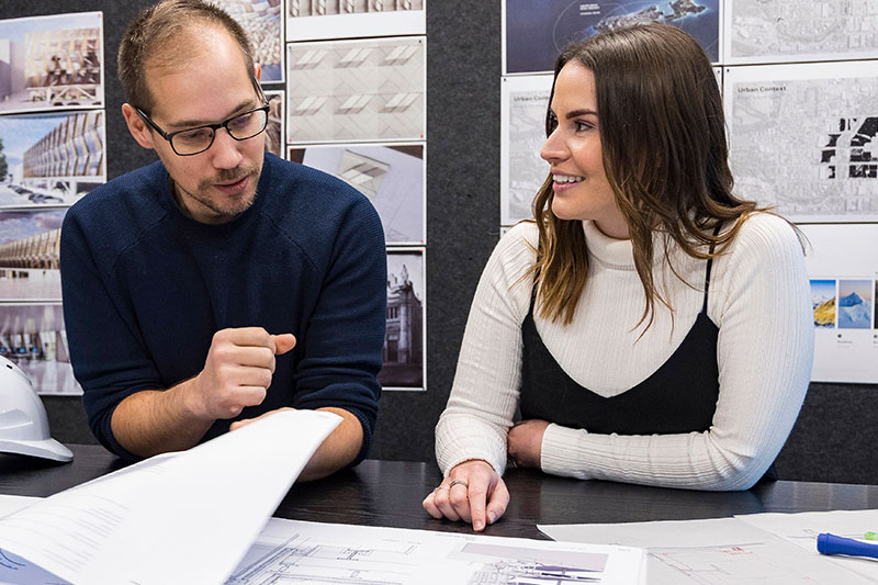 Woman and a man debating a building plan