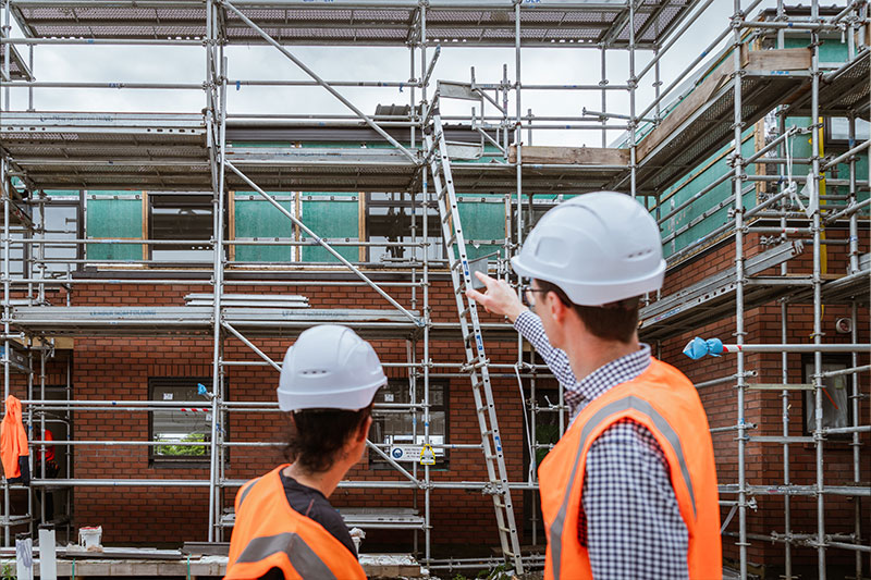 People assessing a building
